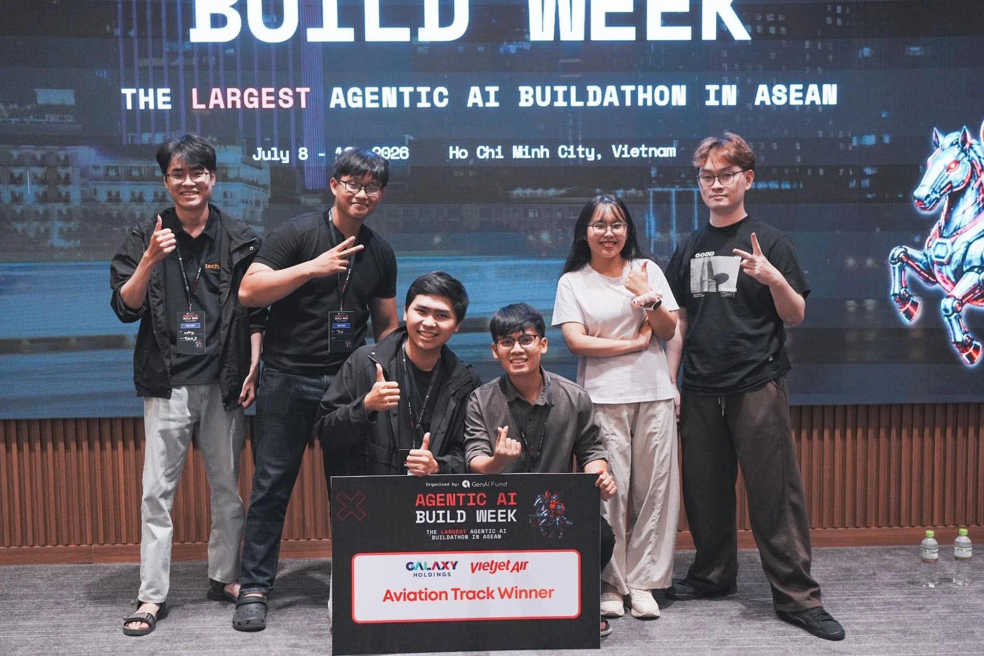 Team SpartansE-V holding the Aviation Track Winner board at Agentic AI Build Week 2026, Ho Chi Minh City